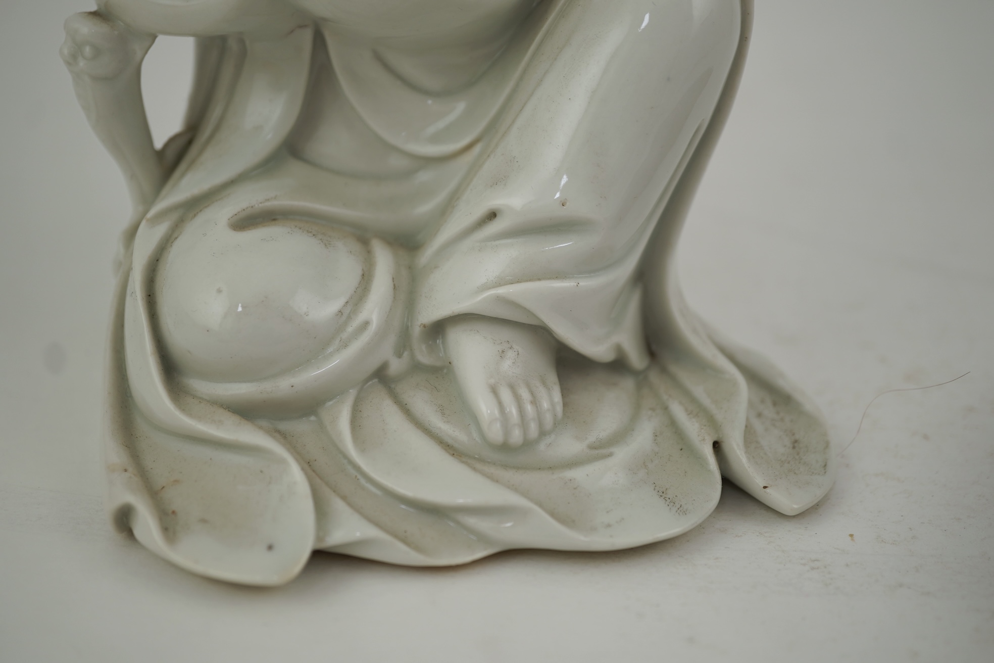 A Chinese blanc-de-chine seated figure of Guanyin, late 19th/early 20th century